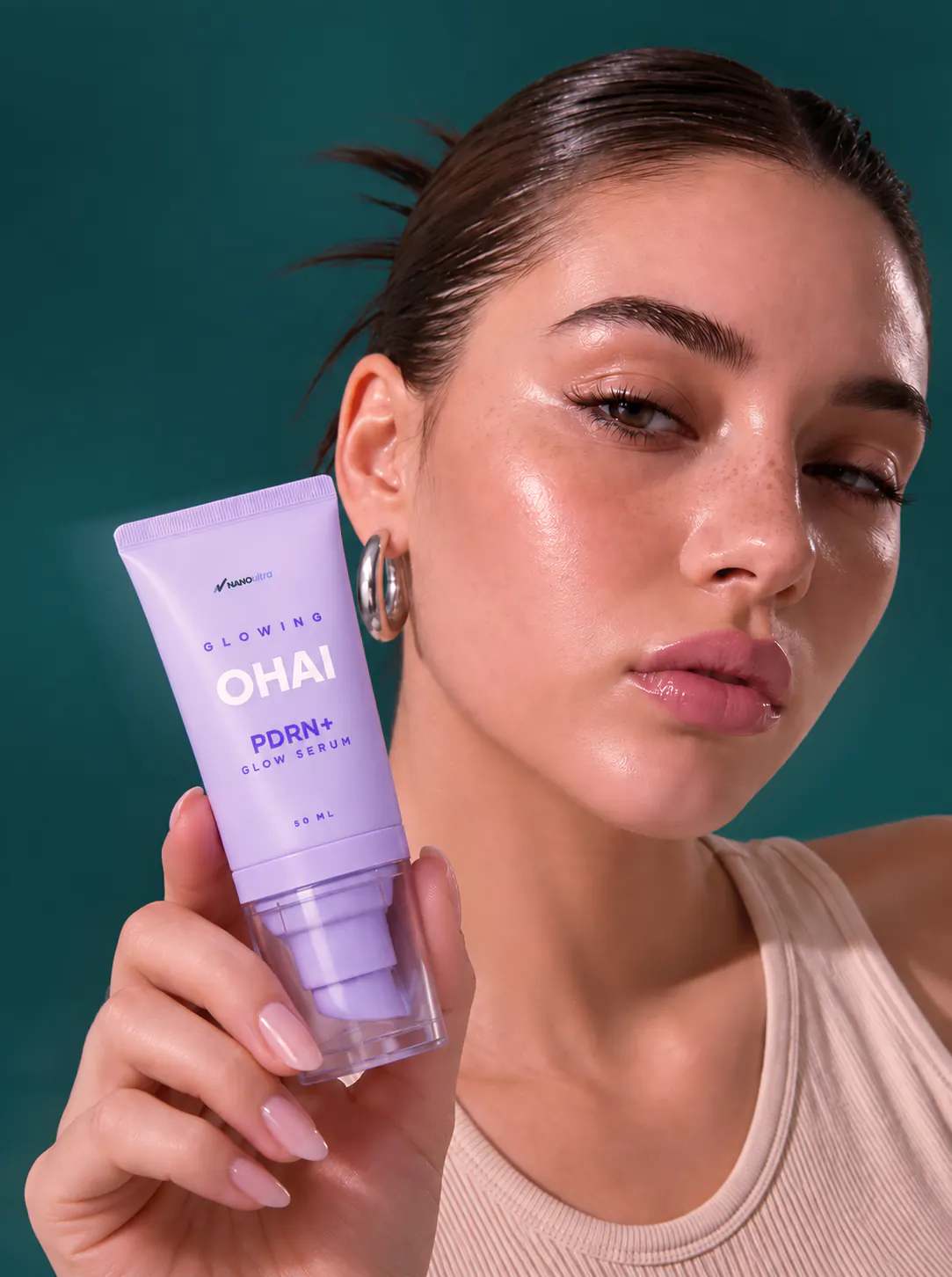 Model holding OHAI PDRN+ Glow Serum by NANOvitra, 50 ml pump tube
